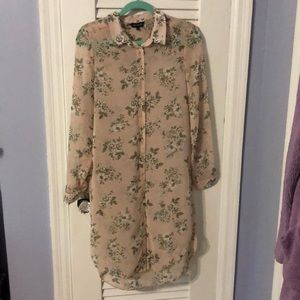 NWOT. Long-sleeved, see-through floral tunic.